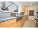 Modern kitchen with stainless steel sink and light wood cabinets at 824 Amsterdam Ne Ave, Atlanta, GA 30306