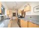 Modern kitchen with light wood cabinets and gray counters at 824 Amsterdam Ne Ave, Atlanta, GA 30306