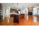 Open kitchen with island, hardwood floors, and views into Gathering room at 978 Kinghorn Nw Dr, Kennesaw, GA 30152