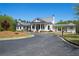 White community center with gray roof and a covered porch at 00 Riverwood Dr, Dallas, GA 30157