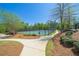 Community tennis courts with a surrounding fence and walking path at 00 Riverwood Dr, Dallas, GA 30157