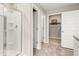 Bathroom with shower, additional closet, and linen closet at 279 Friendship Oak Way, Hampton, GA 30228