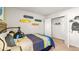 Bedroom with skateboard wall art and built-in closet at 279 Friendship Oak Way, Hampton, GA 30228