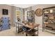 Home office with a rustic wooden desk and built-in shelving at 279 Friendship Oak Way, Hampton, GA 30228