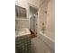 Updated bathroom with tub, shower, and pedestal sink at 51 Peachtree Memorial Nw Dr # 4, Atlanta, GA 30309