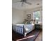 Cozy bedroom with metal bed frame and patterned area rug at 51 Peachtree Memorial Nw Dr # 4, Atlanta, GA 30309