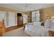 Bright bedroom with hardwood floors and large windows at 51 Peachtree Memorial Nw Dr # 4, Atlanta, GA 30309