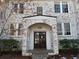 Front entrance with brick facade, arched entryway, and stone walkway at 51 Peachtree Memorial Nw Dr # 4, Atlanta, GA 30309