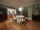 Bright dining room with green walls and a charming table setting at 51 Peachtree Memorial Nw Dr # 4, Atlanta, GA 30309