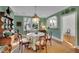 Bright dining room with green walls and a charming table setting at 51 Peachtree Memorial Nw Dr # 4, Atlanta, GA 30309