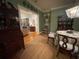 Charming dining room with green walls and a floral tablecloth at 51 Peachtree Memorial Nw Dr # 4, Atlanta, GA 30309