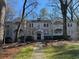 Brick front of charming home with mature trees and landscaped yard at 51 Peachtree Memorial Nw Dr # 4, Atlanta, GA 30309