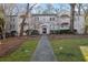 Charming brick building with stone pathway, landscaping, and ample outdoor space at 51 Peachtree Memorial Nw Dr # 4, Atlanta, GA 30309