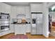 Modern kitchen with stainless steel appliances and white cabinetry at 51 Peachtree Memorial Nw Dr # 4, Atlanta, GA 30309