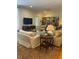 Living room features hardwood floors, comfortable seating, and built-in shelves at 51 Peachtree Memorial Nw Dr # 4, Atlanta, GA 30309