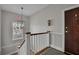 Clean and bright stairwell with a modern light fixture and wood accents at 51 Peachtree Memorial Nw Dr # 4, Atlanta, GA 30309