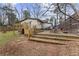 Backyard with a multi-tiered deck, chairs, grill, and a large yard at 883 Verona Dr, Clarkston, GA 30021