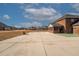 Large backyard with concrete patio and basketball court at 1504 Everson Walk, Hampton, GA 30228