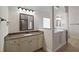 Bathroom features a vanity and walk-in tub at 1504 Everson Walk, Hampton, GA 30228