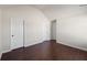 Empty bedroom with hardwood floors and two closets at 1504 Everson Walk, Hampton, GA 30228