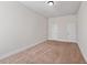 Well-lit bedroom with neutral walls, carpeted floor, and two doors at 1504 Everson Walk, Hampton, GA 30228