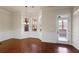 Spacious dining area with hardwood floors and access to patio at 1504 Everson Walk, Hampton, GA 30228