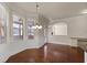 Bright dining room with hardwood floors and built-in window seat at 1504 Everson Walk, Hampton, GA 30228