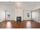 Bright living room with a fireplace and hardwood floors at 1504 Everson Walk, Hampton, GA 30228