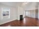 Living room featuring a fireplace and wood-look floors at 1504 Everson Walk, Hampton, GA 30228