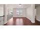 Bright hallway with hardwood floors and access to bedrooms at 1504 Everson Walk, Hampton, GA 30228