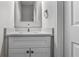 Simple bathroom with white vanity and speckled countertop at 2793 Keystone Ave, Lithonia, GA 30058