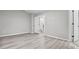 Spacious bedroom with grey walls and wood-look floors at 2793 Keystone Ave, Lithonia, GA 30058