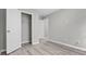 Bedroom with closet, grey walls, and wood-look flooring at 2793 Keystone Ave, Lithonia, GA 30058