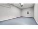 Attached garage with painted floor and overhead storage at 2793 Keystone Ave, Lithonia, GA 30058