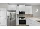 Modern kitchen with stainless steel appliances and white cabinets at 2793 Keystone Ave, Lithonia, GA 30058