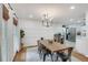 Farmhouse style dining room with wood table and kitchen views at 3839 Redbud Se Ct, Smyrna, GA 30082