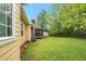 View of the home's side and spacious backyard at 4050 Old Fairburn Rd, Atlanta, GA 30349