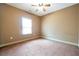 Simple bedroom with neutral walls and carpet at 4050 Old Fairburn Rd, Atlanta, GA 30349