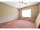 Spacious bedroom with neutral walls and plush carpeting at 4050 Old Fairburn Rd, Atlanta, GA 30349