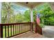 Relaxing front porch with a view of the wooded backyard at 4050 Old Fairburn Rd, Atlanta, GA 30349