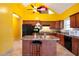 Bright kitchen with island, dark wood cabinets, and stainless steel appliances at 4050 Old Fairburn Rd, Atlanta, GA 30349