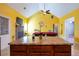 Kitchen with island and view into game room with pool table and fireplace at 4050 Old Fairburn Rd, Atlanta, GA 30349