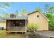 Spacious screened porch with wood flooring and ceiling fan at 4050 Old Fairburn Rd, Atlanta, GA 30349