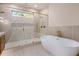 Elegant bathroom featuring a soaking tub and a large shower at 427 Jon Scott Dr, Alpharetta, GA 30009