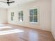 Bright bedroom with hardwood floors and large windows at 427 Jon Scott Dr, Alpharetta, GA 30009