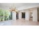 Spacious dining room with large windows and chandelier at 427 Jon Scott Dr, Alpharetta, GA 30009