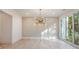 Elegant dining room with wall paneling and chandelier at 427 Jon Scott Dr, Alpharetta, GA 30009