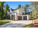 Modern farmhouse style home with white siding and two car garage at 427 Jon Scott Dr, Alpharetta, GA 30009