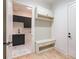 Laundry room with dark cabinetry and geometric tile floor at 427 Jon Scott Dr, Alpharetta, GA 30009