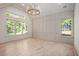 Light-filled living room with hardwood floors and wall paneling at 427 Jon Scott Dr, Alpharetta, GA 30009